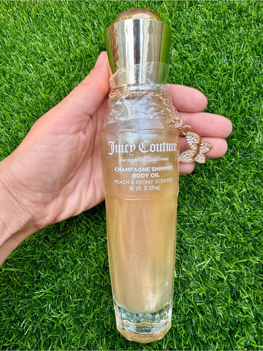 Juicy Couture Champagne Shimmer Body Oil — Gold & Pink Accents